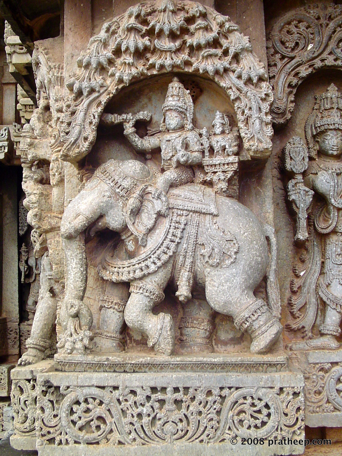 Riding the elephant called Airavat. seated behind indra is his consort, Indrani. 
