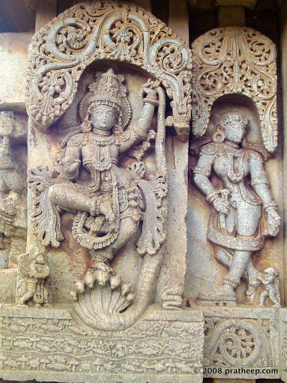 Krishna dancing on the rogue snake called Kaliya. Carving of this popular mythical theme at the Lakshminarayana Temple in Hosaholalu. 