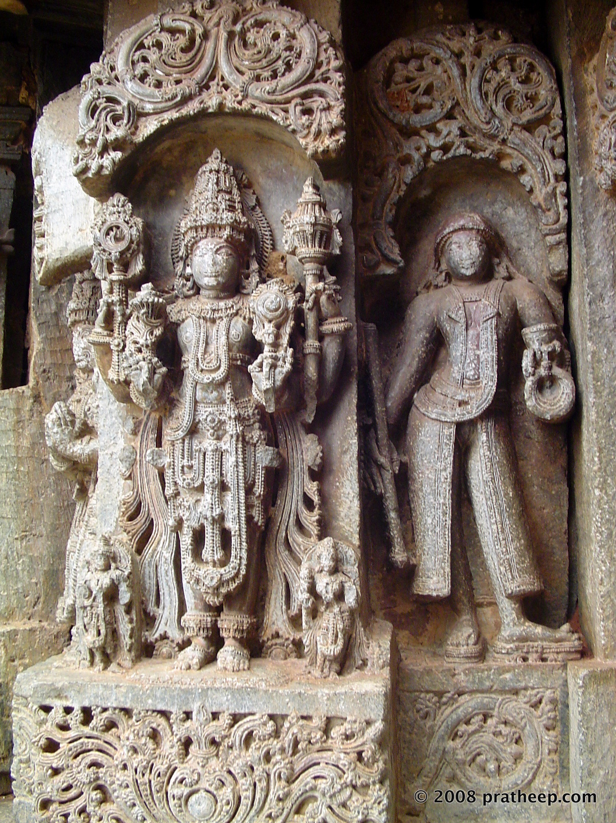 I've seen such image in a few other Hoysala period temples. Not sure what was the circumstance to include a western costumed theme, among the otherwise traditional themes. 