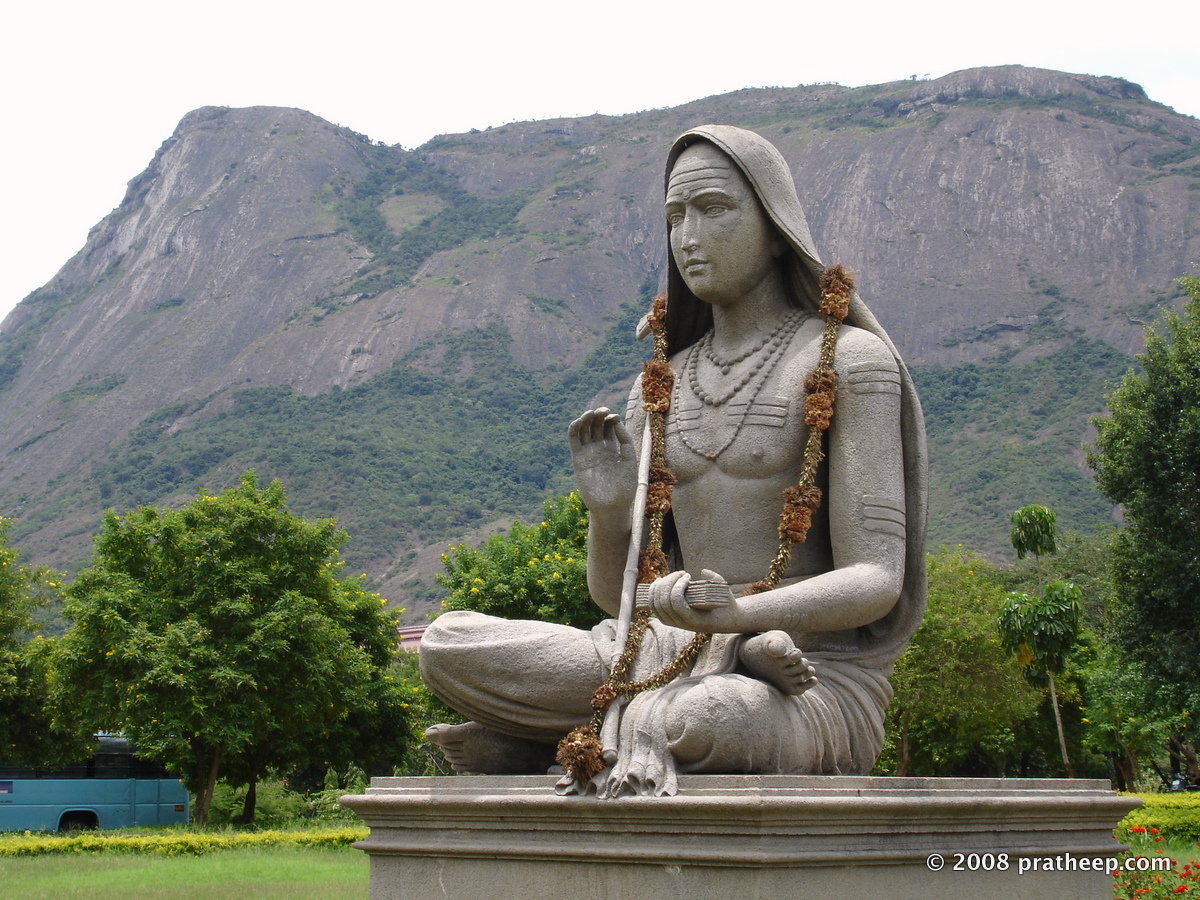 statue at Amrita Viswa Vidhyapeetham . Seen in the backdrop is the elephant shaped granite outcrop at Ettimadai 