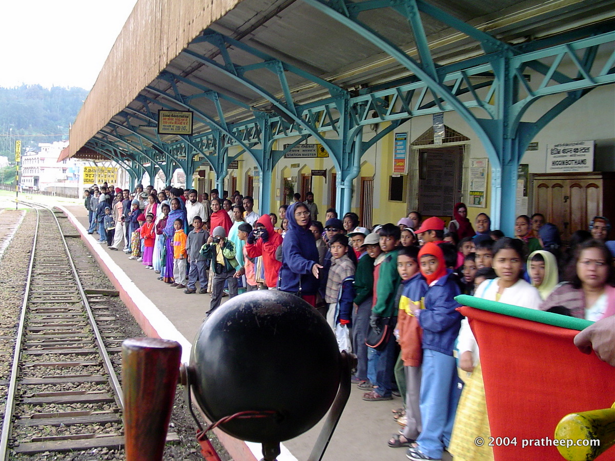 Eagerly awaing passengers - mostly tourists - the train approach the last station in the Nilgiri Mountain Railway.