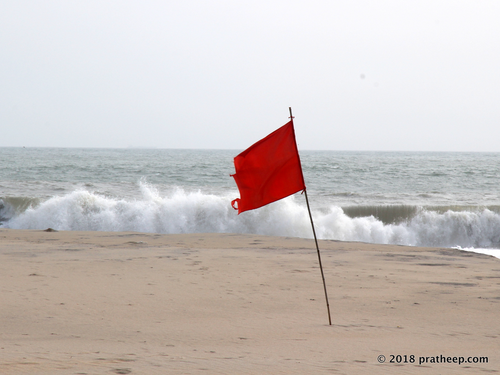 The most serious of all beach warning flags, red flags warn swimmers of severe hazards in the water. Keep away from the water.