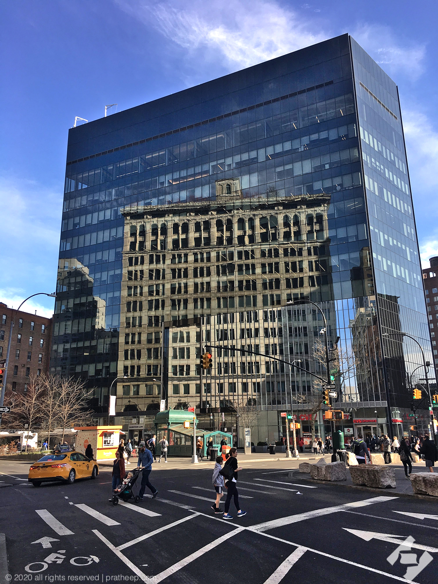 The reflected building is 770 Broadway! 